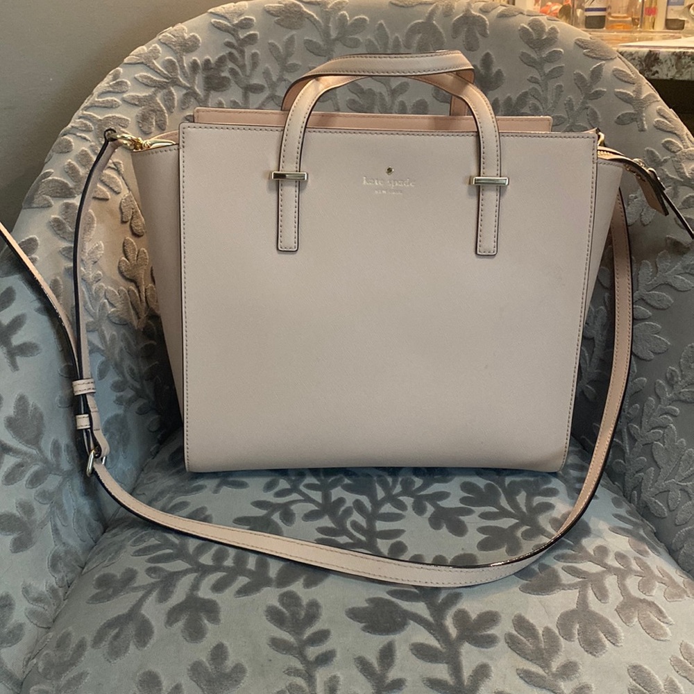 Large pink Kate Spade purse with crossbody strap
